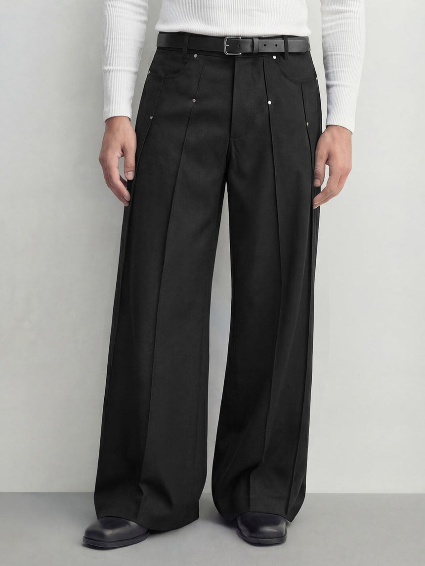 Black wide leg pleated trousers with rivet detail and relaxed tailored fit