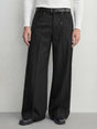 Black wide leg pleated trousers with rivet detail and relaxed tailored fit