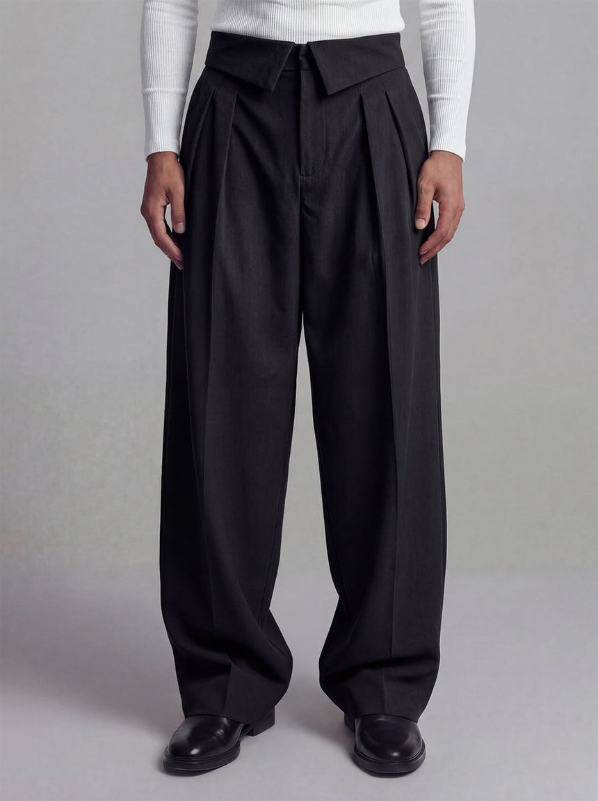 Black inverted waist tailored trousers with wide leg silhouette